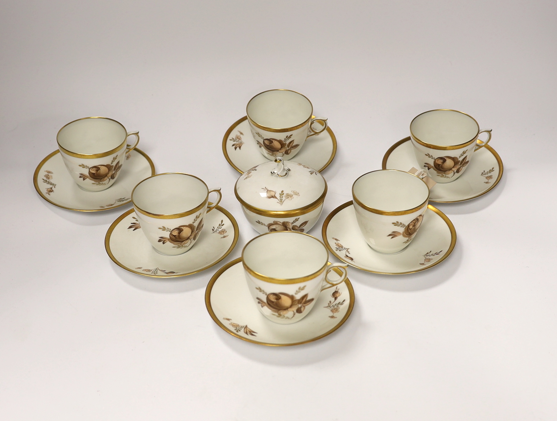 A Royal Copenhagen part coffee set comprising six cups and saucers and a jar and cover, largest 12.5cm in diameter